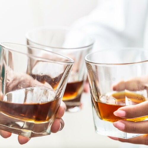 group friends toasting glasses whiskey brandy rum indoors closeup 193276493